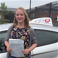 Maddy Hodgkinson – Jim #3 200 A very happy new driver Maddy holding her first time pass driving test certificate outside the JSF Driving School car