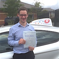 James Phelps – Jim #3 200 James Phelps smiling with his practical driving test pass certificate beside the JSF Driving School car