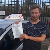 Cameron Watkins – Jim #3 200 New driver Cameron Watkins smiling next to the JSF Driving School car holding his practical test pass certificate