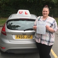 Congratulations to Laura Graham from Bream on her practical driving test pass New driver Laura Graham from Bream proudly holding her practical driving test pass certificate next to the JSF Driving School car