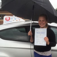 Susan Morgan holder her Practical Driving Test pass certificate