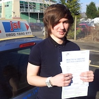 Zack Turley holding his Practical Driving Test Pass Certificate