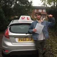 New JSF driver Connor Brookes thumbs up holding his practical test pass certificate